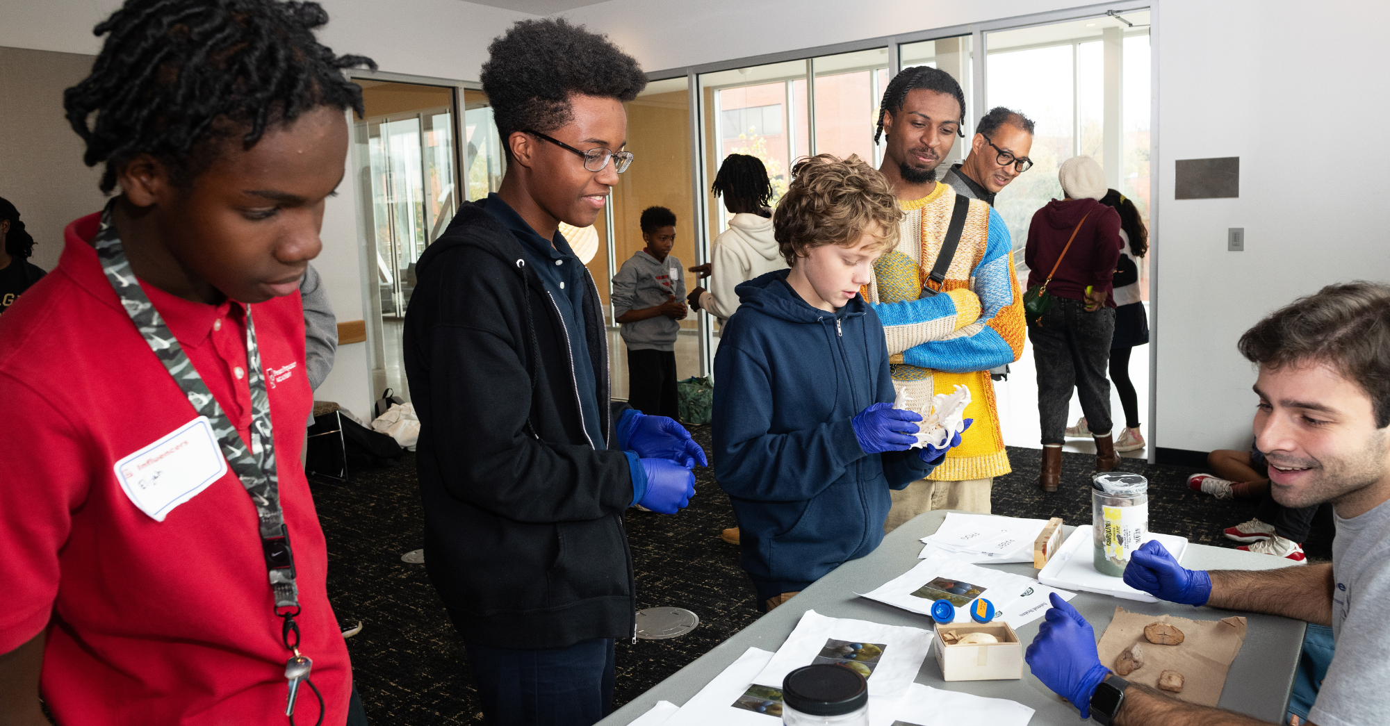 Younger students talking to college student