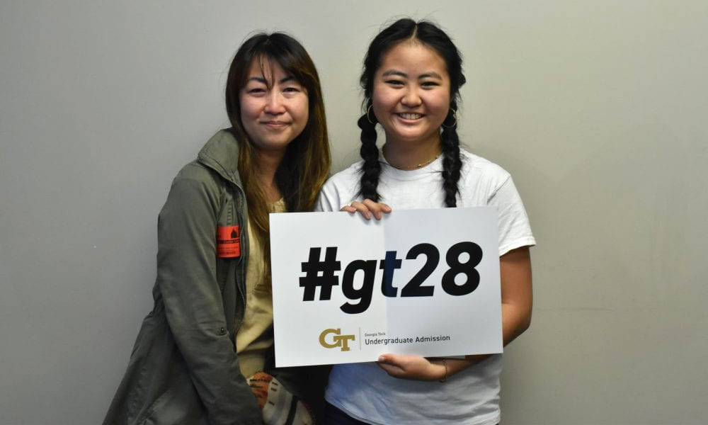 Keiko (left) and Sola Ishibashi (right) pose for a photo following the hand delivery of Sola’s Georgia Tech acceptance letter on Friday, December 8, 2023.